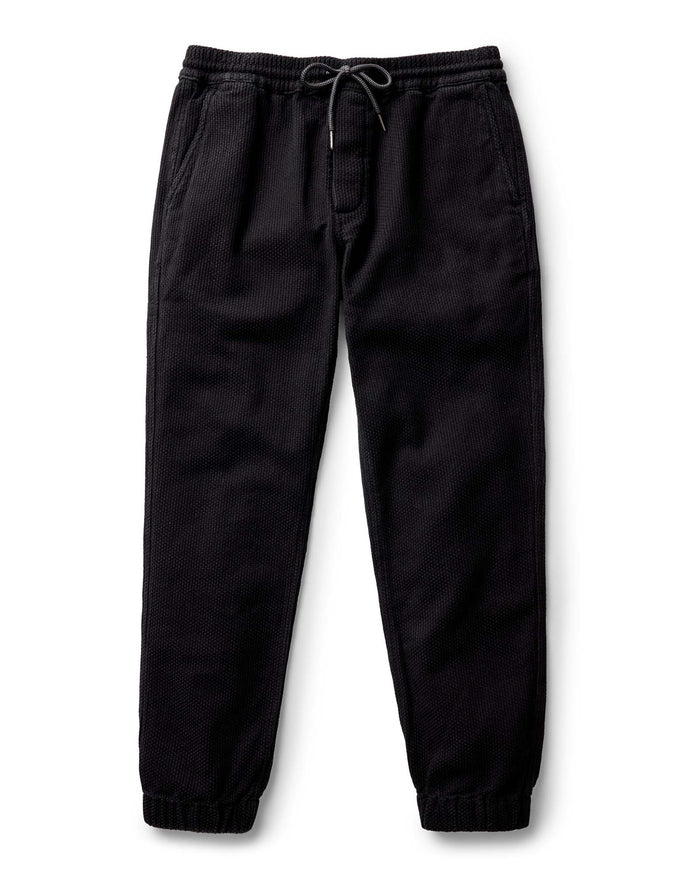 Black pants with drawstring on a white background