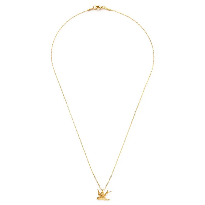 Gold necklace with a small pendant on a white background