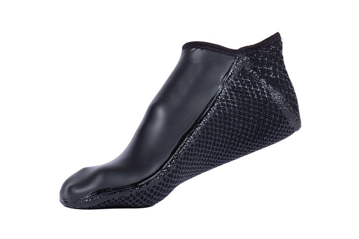 Waihana Essentials Black short neoprene dive sock featuring a smooth rubber upper panel and textured grip sole, shown in profile against a white background.
