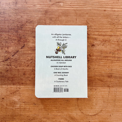 The back cover of the book shown displayed on a wooden surface