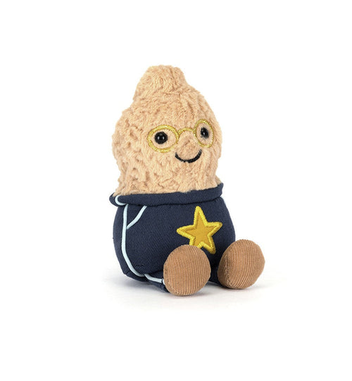 Plush toy resembling a peanut character with a star on a white background