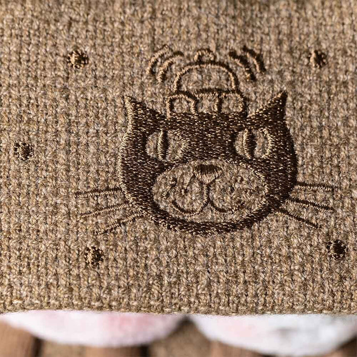 Embroidered Jellycat logo design on a textured fabric surface