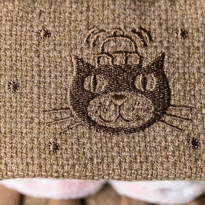 Embroidered Jellycat logo design on a textured fabric surface