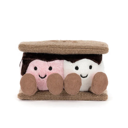 Plush toy resembling a s'more with a brown top and pink and white marshmallows on a white background