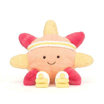 Plush toy resembling a sun with a smiley face on a white background