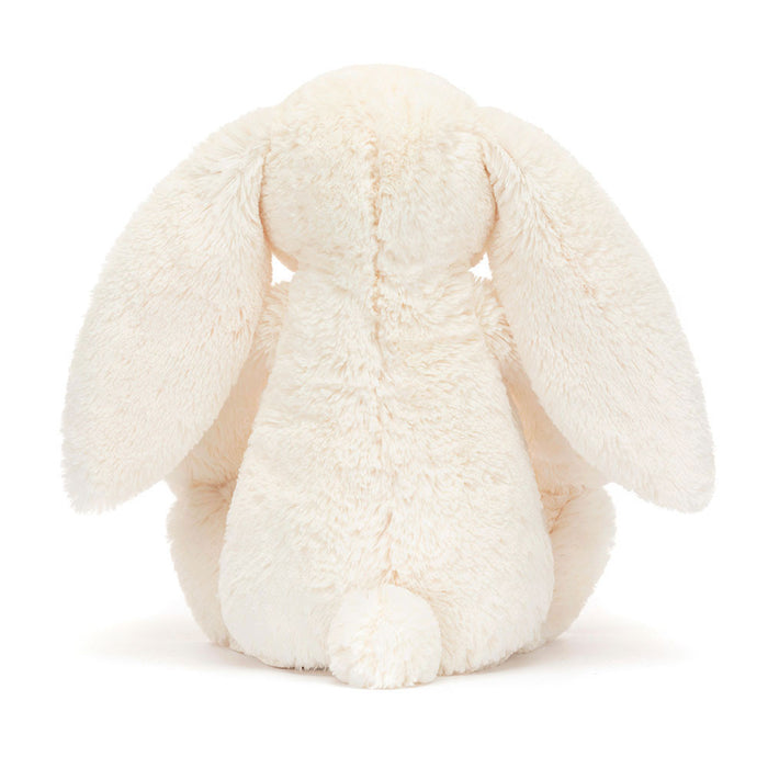 Jellycat Blossom Cream Bunny 'Berry' Original — rear view showing the cream textured fur, wide floppy ears, and small white cotton tail, on a white background