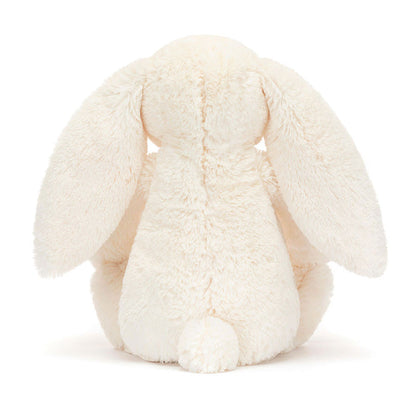 Jellycat Blossom Cream Bunny 'Berry' Original — rear view showing the cream textured fur, wide floppy ears, and small white cotton tail, on a white background