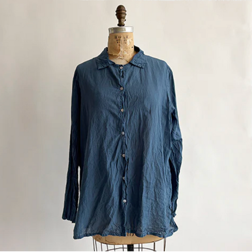 Blue shirt on a mannequin against a plain background