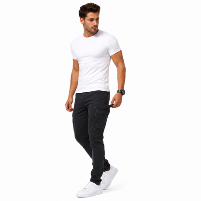 Slim stretch denim cargo pants shown with mid-rise waist, utility styling and defined leg shape for men's casual outfit wear.