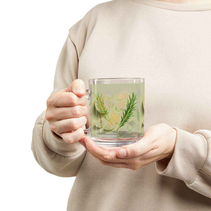 Person holding a clear mug with green herbs and leaves against a white background