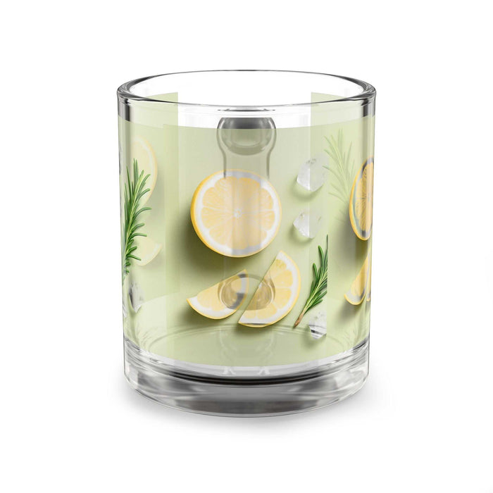 Clear glass with lemon slices and herbs on a white background