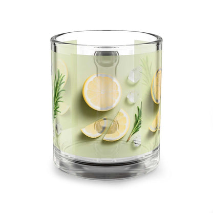 Clear glass with lemon slices and herbs on a white background