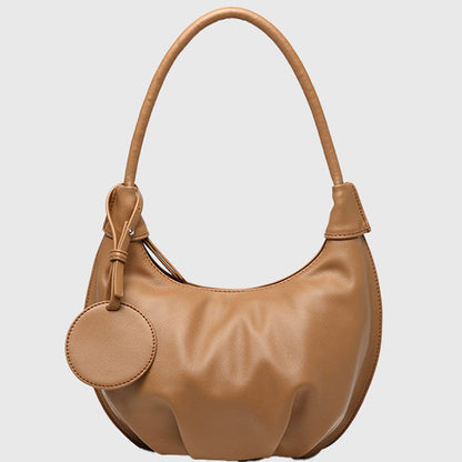Pink crescent shoulder bag, in PU leather with zipper closure, single strap and curved shape shown in a square product image.