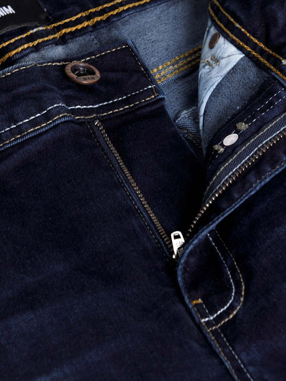 Close-up of dark navy denim jeans zipper and button detail with contrast stitching – Wam Denim.