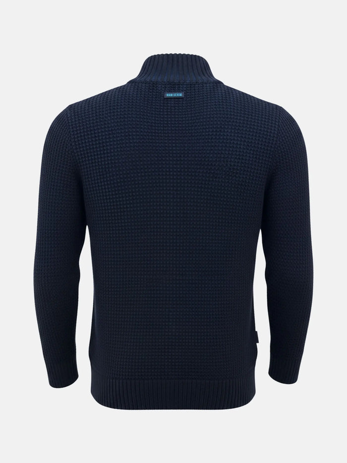 Back view of an indigo navy men’s knit sweater with a textured waffle pattern.