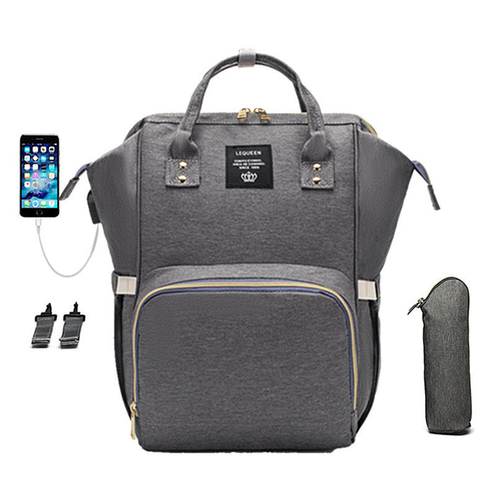 A large capacity mummy bag for diapers, bottles, spare clothing and personal belongings during family trip and daily errands.