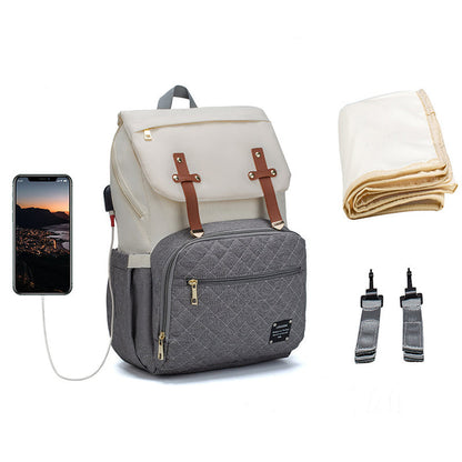 Oxford cloth diaper tote with shoulder, crossbody and handheld carrying options for parents organizing daily baby essentials.