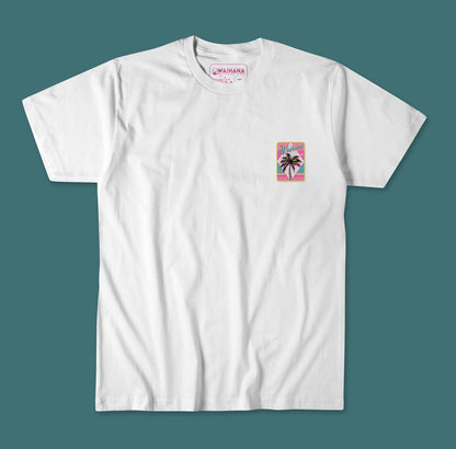 Waihana Electric Palms Premium Pima T-Shirt in White Sand, displayed flat against a teal background, featuring a small retro pink and teal palm tree graphic on the left chest.