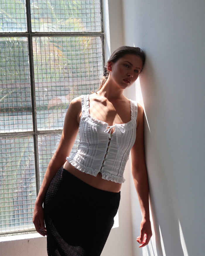 Eliza Top in Bianco white resort blouse with lace paneling, button-up front, and ruffled hem
