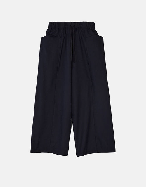 Navy wide-leg pants with a relaxed boyfriend fit, featuring an elastic waistband and large front pockets, crafted from wrinkle-resistant fabric for timeless minimalist style.