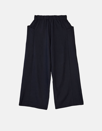 Navy blue boyfriend fit flared pants with an elastic waistband, designed for comfort and wrinkle resistance, exemplifying minimalist and timeless style.