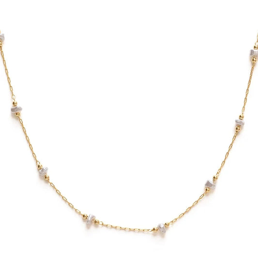 A gold-plated brass chain necklace with freshwater pearl stations, displayed against a white background.
