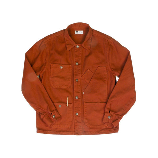 Front view of the Tellason Garment Dyed Coverall Jacket in International Orange, laid flat on a white background, showing the point collar, button front, four utility pockets, and pencil pocket detail