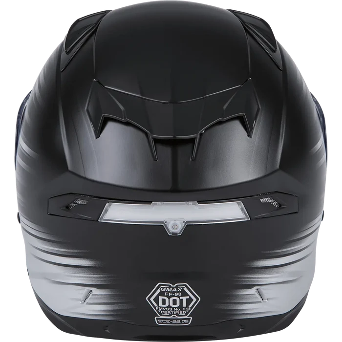 Rear view of GMAX full-face motorcycle helmet in black and silver gradient with DOT certification label.