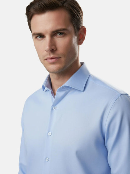 Model wearing blue dress shirt with classic collar, close-up view.