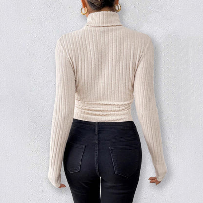 long sleeve high neck bodysuit front view in apricot, slim fit jumpsuit-style body for clean minimal outfits