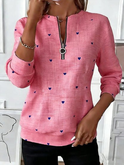 Printed Christmas sweatshirt for women with long sleeves, loose fit and fleece construction shown for casual holiday styling.