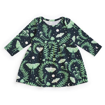 Children's dress with green leaf pattern on a white background
