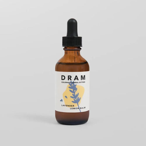 DRAM Colorado Herbal Bitters Lavender Lemon Balm Bitters 2 oz amber glass dropper bottle with illustrated label featuring a periwinkle blue lavender sprig on a soft yellow wash, against a light grey background