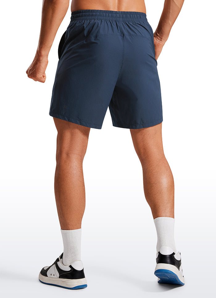 CRZ YOGA Men's Training Quick Dry Pocketed Linerless Shorts 7'' Stelindigo