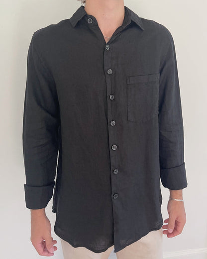 Front view of Two Sons black linen button down shirt with chest pocket and rolled cuffs