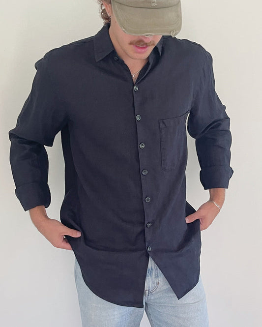 Model wearing the Linen Button Down in Lights Out in size medium, garment-dyed linen button-down shirt made in California