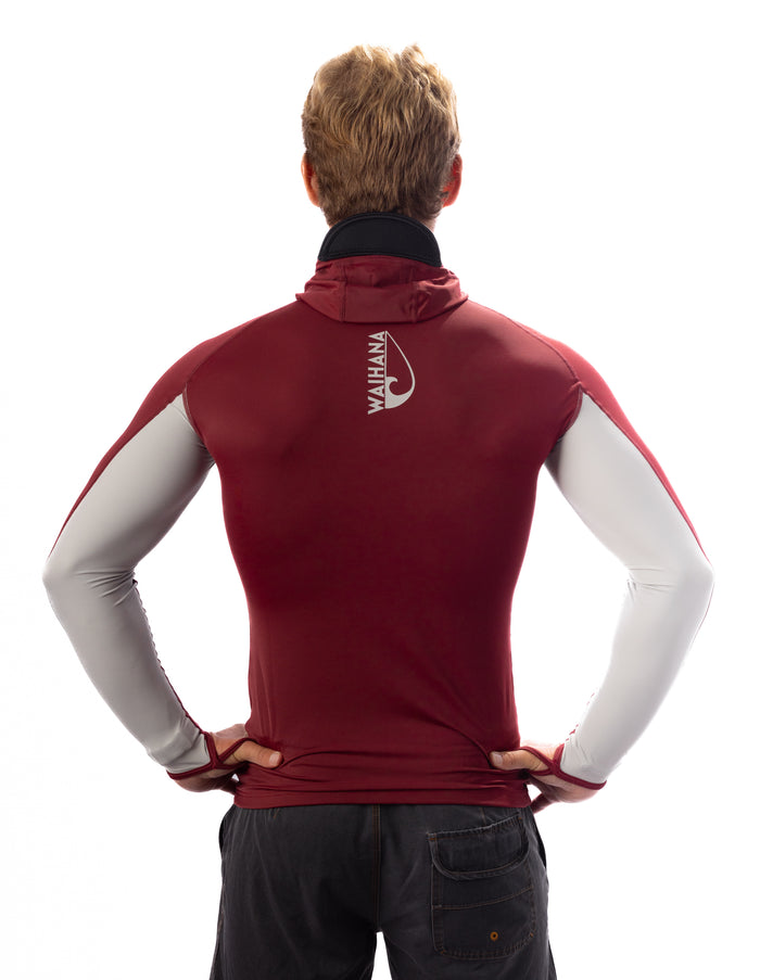 Back view of a man wearing the Waihana Maroon Carvico Hooded Surf Rashguard with grey sleeve accents and Waihana logo on the upper back, styled with dark shorts on a white background.