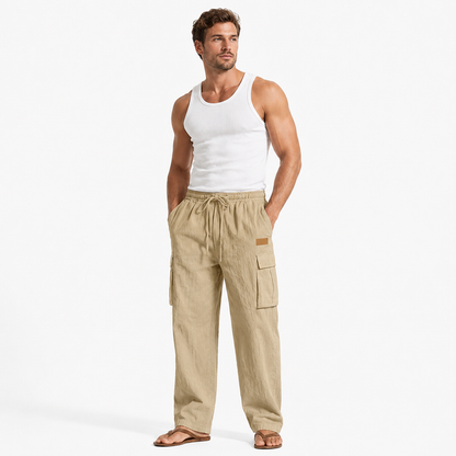 Men's cotton linen pants in khaki shown on an adult male model in a minimal studio lifestyle pose with a clean white background.