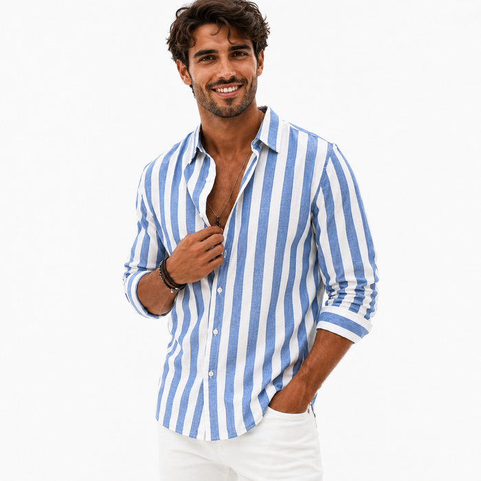 Men's blue and white striped button-front shirt on a male model touching the placket, photographed against a clean white background.