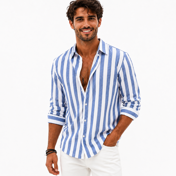 Men's blue and white striped casual shirt shown on a male model with rolled sleeves and a relaxed pose on a white studio background.