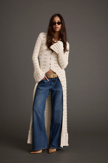 Detail shot of the Nicoletta Cream Knit Longline Top highlighting the knit elements.