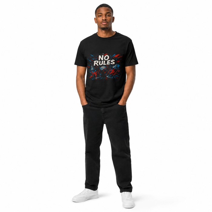 A man modeling a black crewneck t-shirt with a colorful graphic that reads 'NO RULES' in white, paired with black pants and white sneakers, against a plain white background.