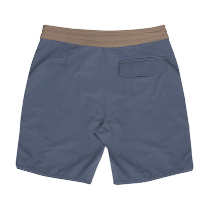 Back view of Waihana Offshore Blue Cruiser board shorts featuring a tan elastic waistband, a single back pocket with orange accent stitching, on a white background.