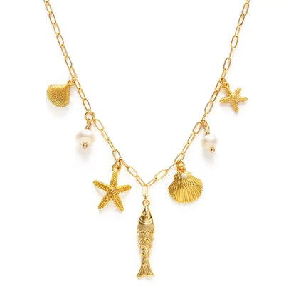 Gold necklace with starfish, shell, and fish charms on a white background