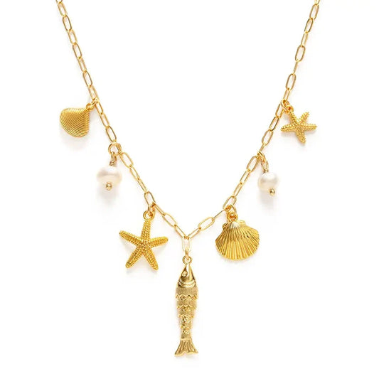 Gold necklace with starfish, shell, and fish charms on a white background