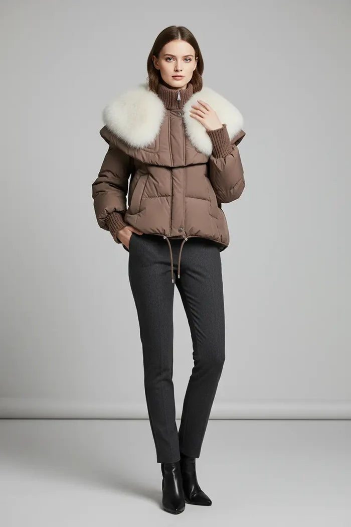 short parka coat with faux fur collar shown in white, thick quilted body, high neckline and structured shoulder cape