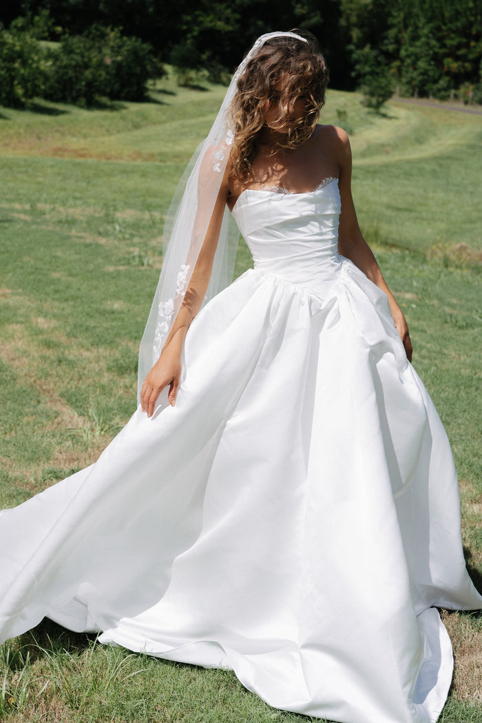 Woman in a white wedding dress with a veil