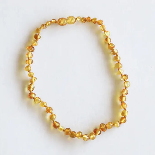 Necklace with amber beads on a white background