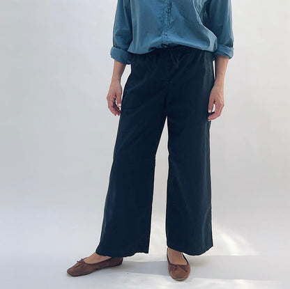 Poplin Sailor Pant in Ink — front view, wide-leg silhouette with drawstring waist, worn with a blue button-down shirt and brown flats