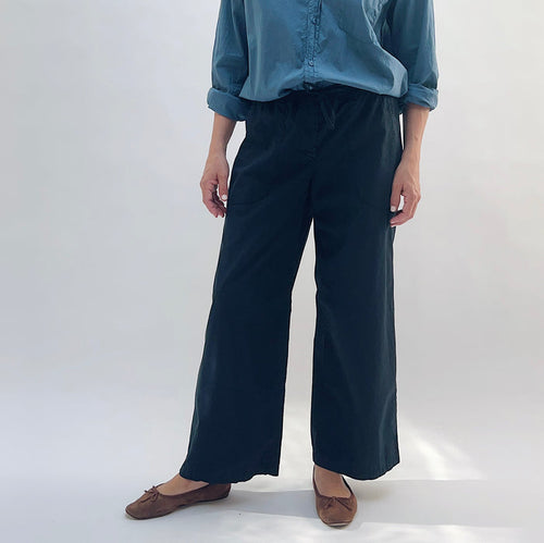 Poplin Sailor Pant in Ink — front view, wide-leg silhouette with drawstring waist, worn with a blue button-down shirt and brown flats